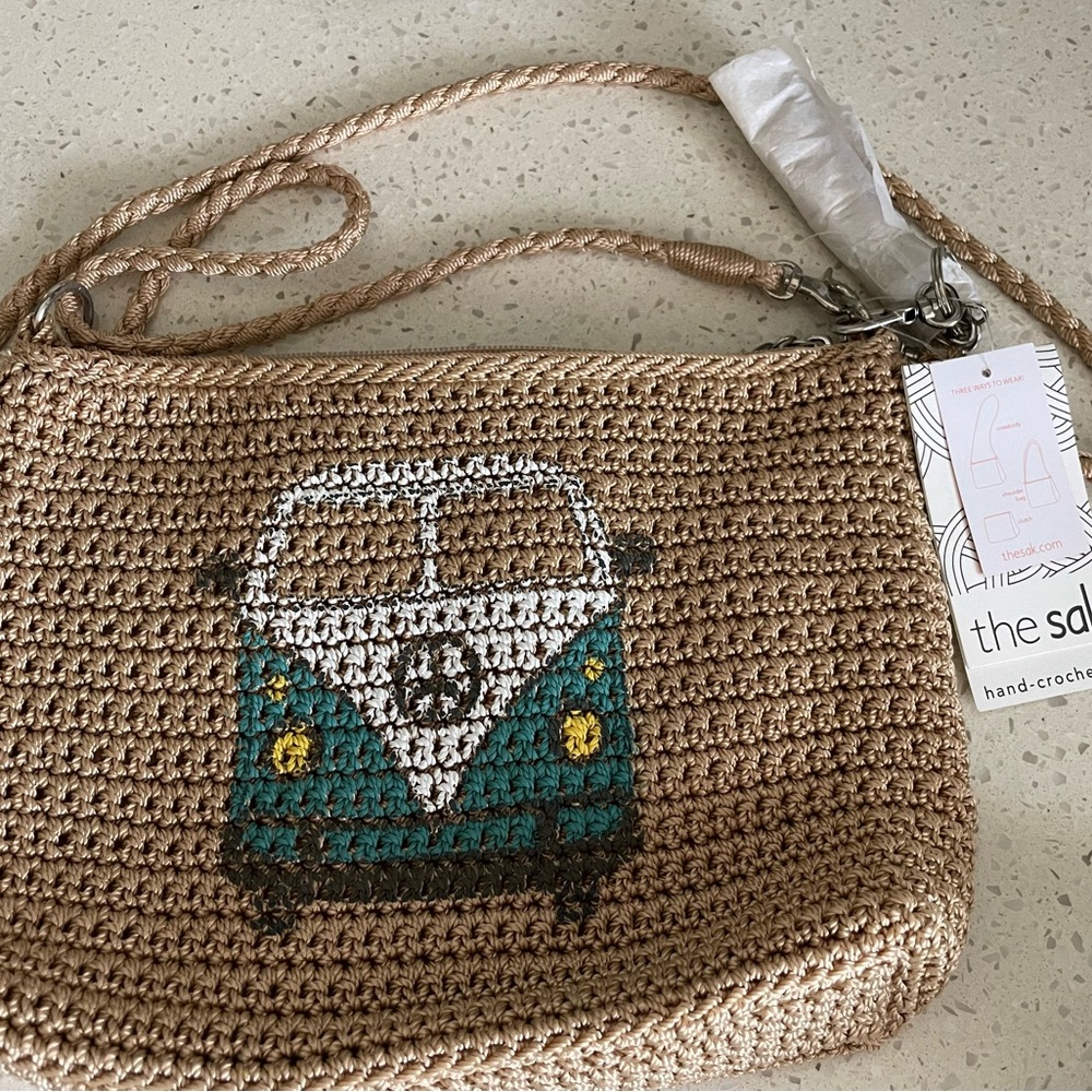 The Sak Hand-Crocheted Tan and Teal Bag with volkswagen bus design